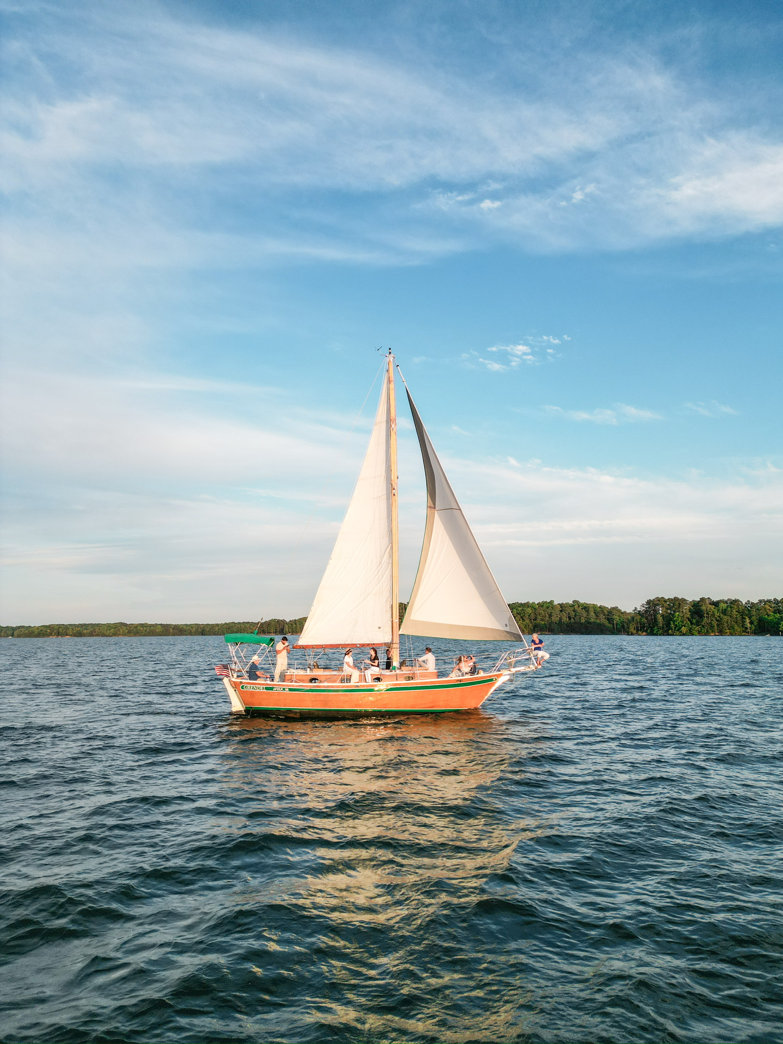 Aerial drone view of a sailboat on Lake Lanier on a clear sunny day