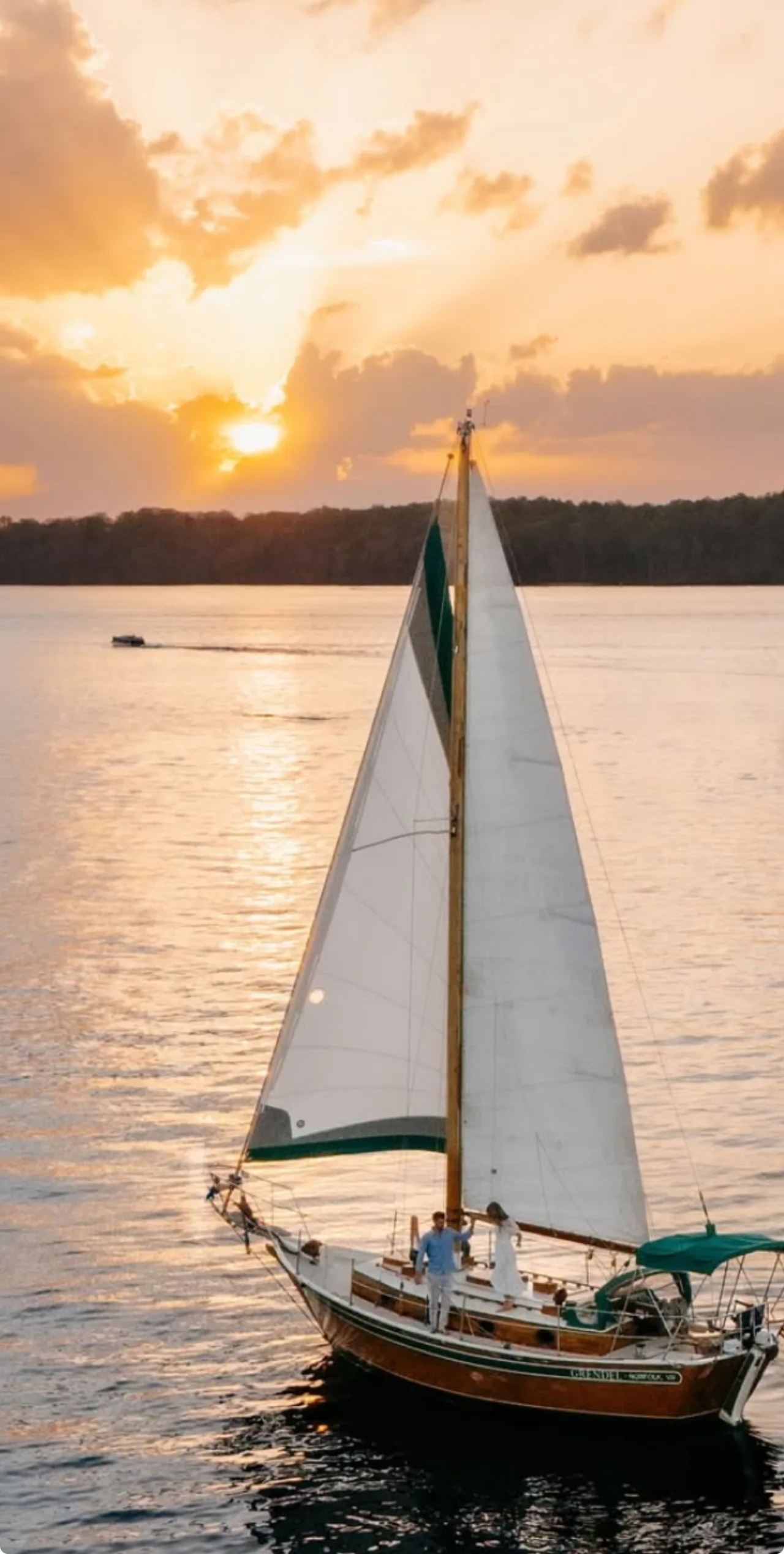 A couple aboard Lord Nelson at golden hour on Lake Lanier