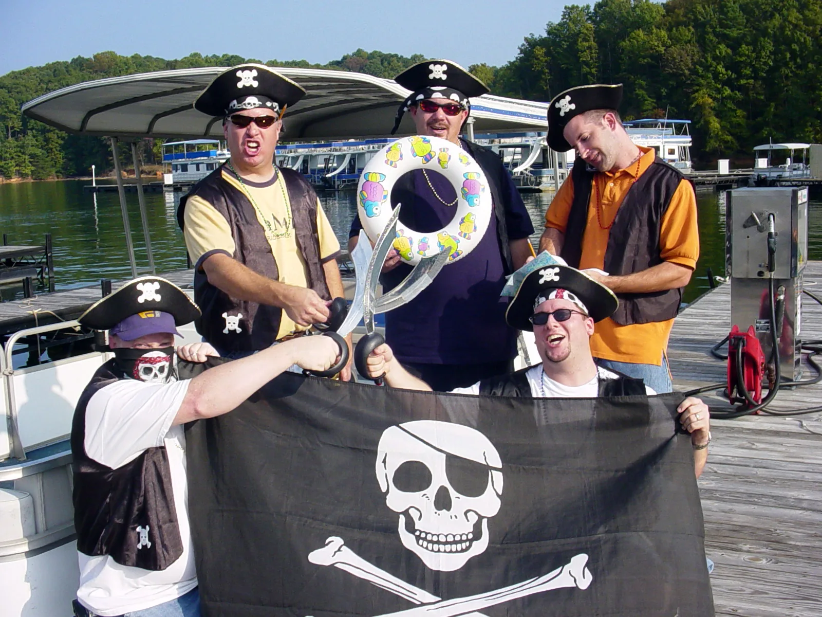 Group of guests in pirate costumes enjoying the Pirate Cruise on Lake Lanier